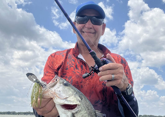 Angler Holding Large Bass Caught With Chatterbait