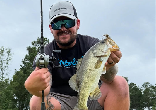 Angler using KastKing gear for finesse fishing in autumn waters