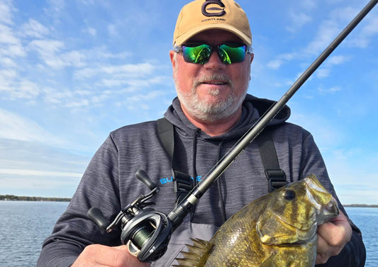 Angler fishing with KastKing Mg-Ti baitcasting reel on Lake Ontario